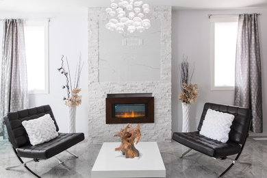 Living room - mid-sized modern open concept porcelain tile living room idea in Edmonton with gray walls, a standard fireplace, a stone fireplace and no tv