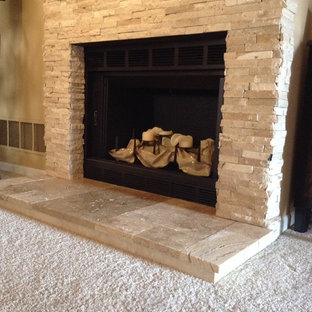 Design ideas for a small mediterranean living room in Indianapolis with a stone fireplace surround.