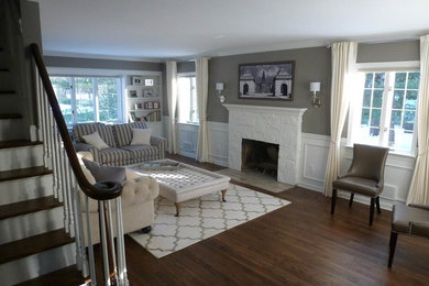 Family room - mid-sized contemporary open concept dark wood floor and brown floor family room idea in Other with gray walls, a standard fireplace, a stone fireplace and no tv