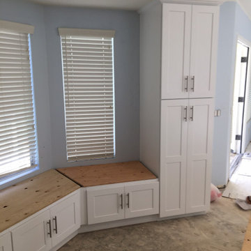 Kitchen white shaker upper cabinets and dark grey shaker base cabinets