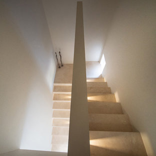 Inspiration for a medium sized and mixed contemporary u-shaped staircase in Other with travertine treads and travertine risers.