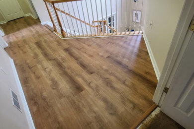 Inspiration for a timeless vinyl floor hallway remodel in Other