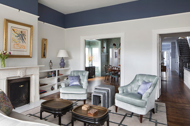 Living room - mid-sized victorian formal and enclosed dark wood floor and brown floor living room idea in San Francisco with white walls, a standard fireplace, a stone fireplace and no tv