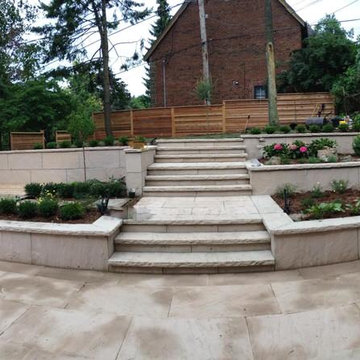 Terraced Backyard - natural stone patio, deck for seating, terraced gardens
