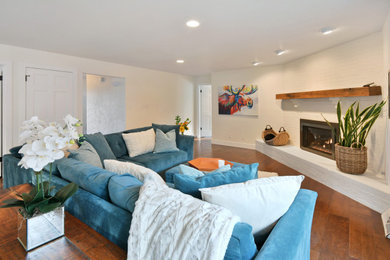Example of a beach style family room design in Denver
