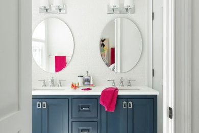 Design ideas for a mid-sized transitional kids bathroom in New York with blue cabinets, white tile, ceramic tile, white walls, porcelain floors, an undermount sink, engineered quartz benchtops, white floor, white benchtops, a double vanity, a built-in vanity and recessed-panel cabinets.