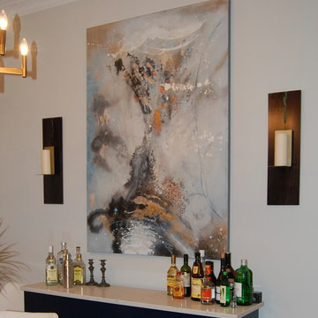 Color was added through oversized artwork and custom wall sconces