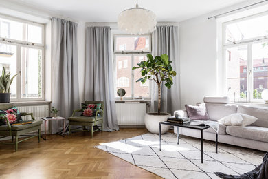 Inspiration for a large transitional open concept living room in Stockholm.