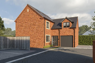 This is an example of a red classic brick and front detached house in Wiltshire with three floors, a tiled roof and a grey roof.