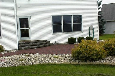 This is an example of a large full sun stone formal garden in Other.