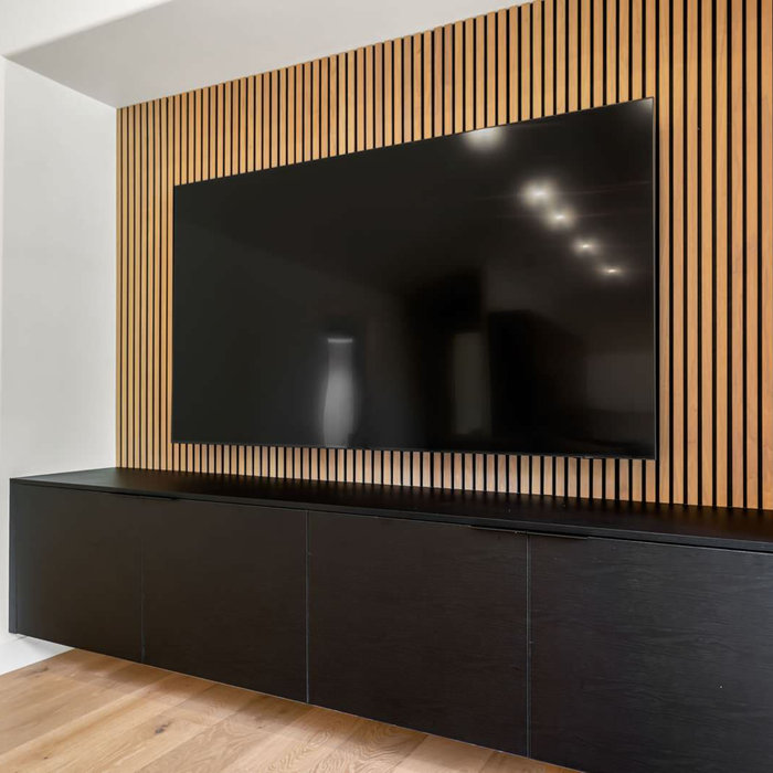 Media wall with paneling and floating media center
