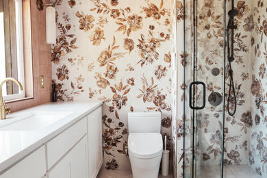 Inspiration for a mid-sized 1960s master multicolored tile and porcelain tile ceramic tile, beige floor and single-sink doorless shower remodel in Portland with shaker cabinets, white cabinets, a one-piece toilet, an undermount sink, quartzite countertops, a hinged shower door, white countertops, a niche and a freestanding vanity
