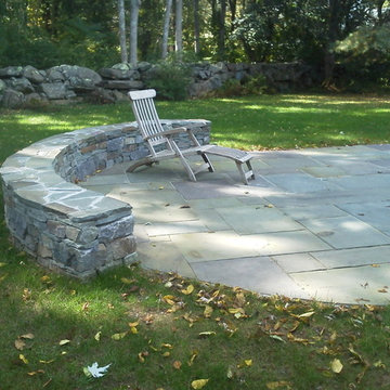 Curved wall with bluestone patio