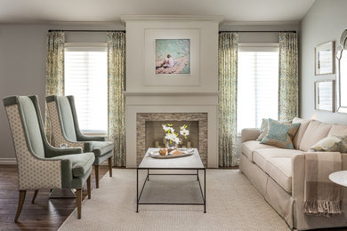 Inspiration for a mid-sized timeless formal and open concept medium tone wood floor living room remodel in San Diego with gray walls, a standard fireplace, no tv and a tile fireplace
