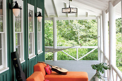 This is an example of a mid-sized craftsman front porch design in Other with decking and a roof extension.