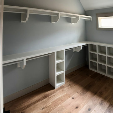 Elegant Guest Closet Organization: White Built-Ins, Open Cubbies, and Hanging St