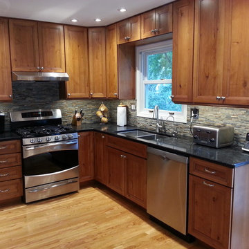 Schuler Cabinetry - Monroe Door in Knotty Alder with Hazelnut Ebony Glaze
