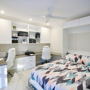 Design ideas for a medium sized modern study in Sydney with white walls, ceramic flooring, a built-in desk and beige floors.