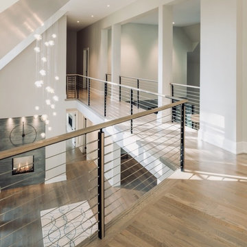Vaddi - floating double steel center stringer with cable railing