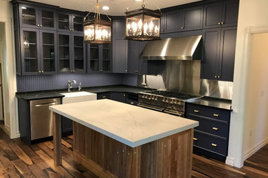 Example of a trendy medium tone wood floor eat-in kitchen design in Other with glass-front cabinets, purple cabinets, quartz countertops, wood backsplash, stainless steel appliances and an island