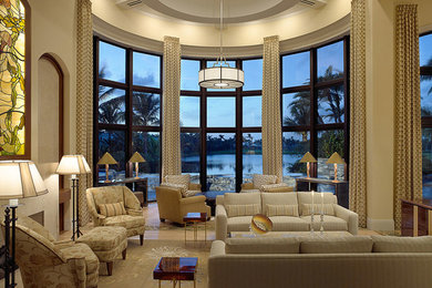 Living room - huge mediterranean formal and open concept light wood floor living room idea in Miami with beige walls, a standard fireplace, a stone fireplace and no tv