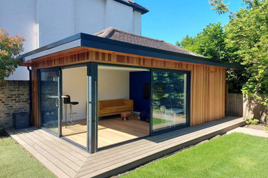 Design ideas for a medium sized contemporary garden shed and building in Surrey.