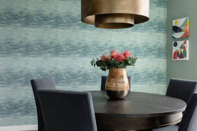 Example of a mid-sized minimalist medium tone wood floor, gray floor and wallpaper great room design in Seattle with green walls