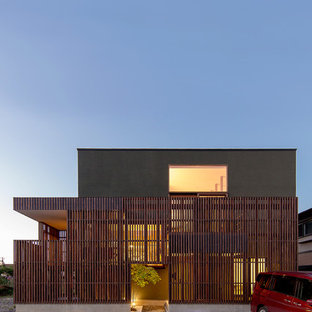 Zweistöckiges, Graues Asiatisches Einfamilienhaus mit Mix-Fassade und Flachdach in Sonstige