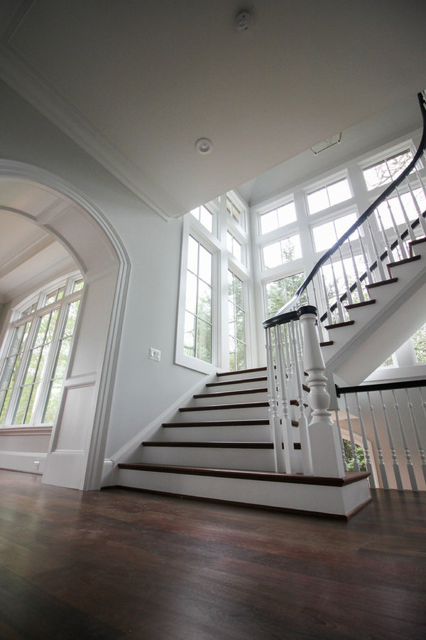 Powerful Impression by Floating Staircase in Suburban Foyer