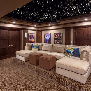 Inspiration for a timeless enclosed carpeted and multicolored floor home theater remodel in Chicago with beige walls