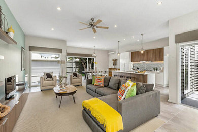This is an example of a modern open concept family room in Melbourne.