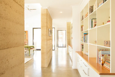 Mid-sized contemporary hallway in Adelaide with white walls, concrete floors and grey floor.
