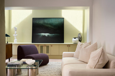 This is an example of a contemporary family room in Sydney with beige walls.