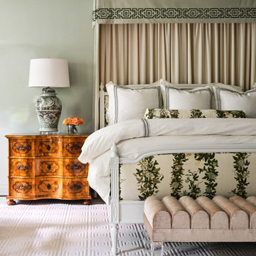High gloss walls and custom bedding in a traditional primary bedroom