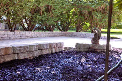 Patio - concrete paver patio idea in Charleston