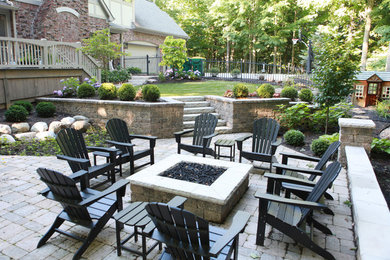 Patio - large traditional backyard concrete paver patio idea in Indianapolis