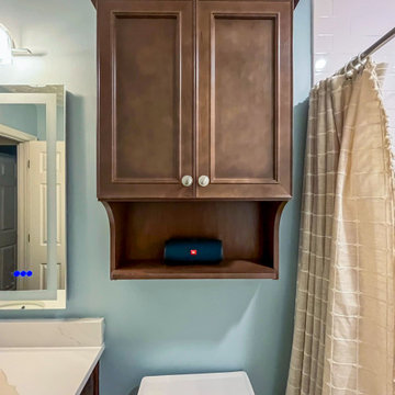 Guest Bathroom Transformation with Stylish Wood Vanity and Custom Shower