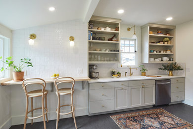 Mid-sized minimalist galley gray floor seated home bar photo in Portland with an undermount sink, shaker cabinets, white cabinets, quartz countertops, white backsplash and white countertops