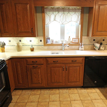 Tile Backsplash with Glass Accents and Oil Rubbed Bronze Cast Metal Tiles