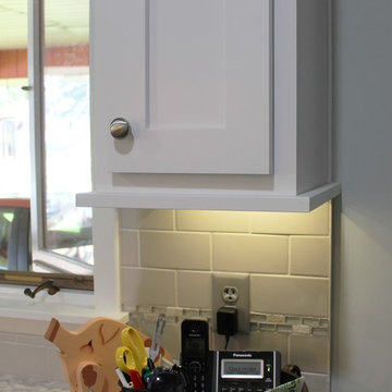White Upper Cabinet and Gray Base Cabinet Kitchen With Quartz Counters