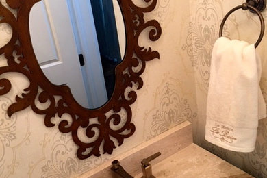 Inspiration for a transitional powder room remodel in Other with an undermount sink