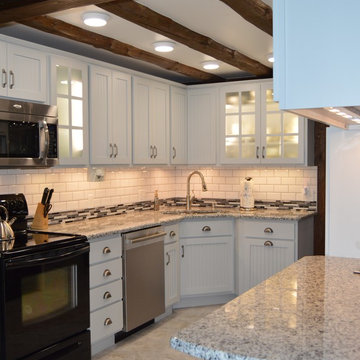 Gray Transitional Kitchen in Rustic Log Home by McLusky Showcase Kitchens & Bath