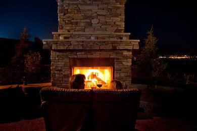 Huge elegant backyard brick patio kitchen photo in Calgary with no cover