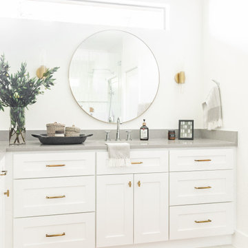Bathroom Design Dallas – Double Vanity with Round Mirror & Brass Accents | Lark