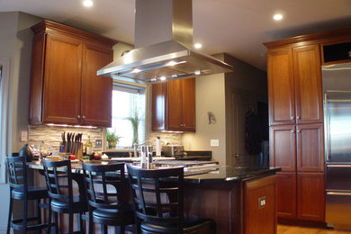 Open concept kitchen - large modern l-shaped light wood floor open concept kitchen idea in Chicago with a double-bowl sink, recessed-panel cabinets, medium tone wood cabinets, solid surface countertops, gray backsplash, glass tile backsplash, stainless steel appliances and an island