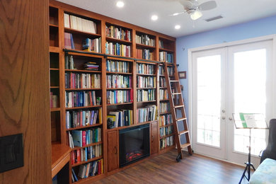 Custom Library with Ladder, Fireplace & Desk!