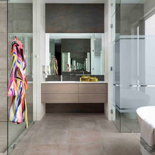 Bathroom with enclosed toilet