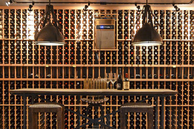 Large urban concrete floor wine cellar photo in Seattle