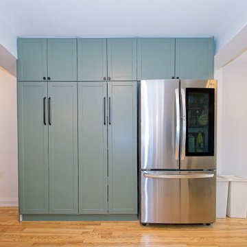 Full-Height Green Pantry with Stainless Refrigerator | East York