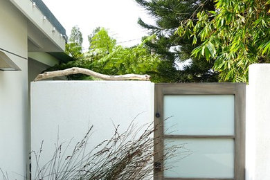 Mid-sized trendy white one-story stucco exterior home photo in Santa Barbara
